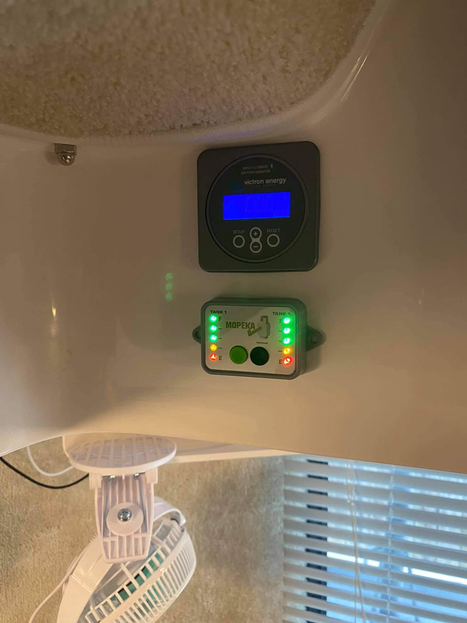 Victron battery monitor and solar controls mounted inside the Casita