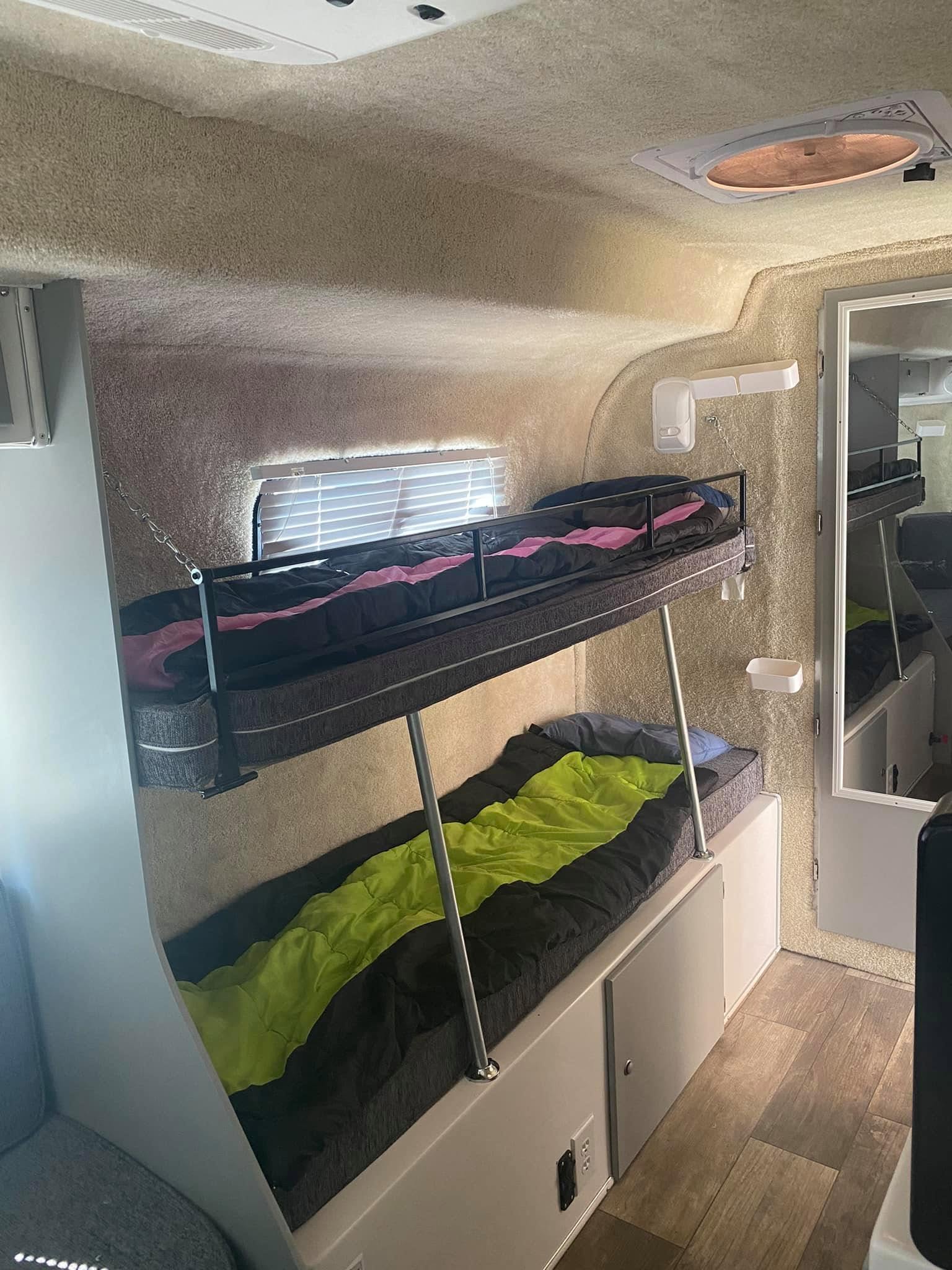 Casita Heritage Deluxe bunk beds above the battery-storage area